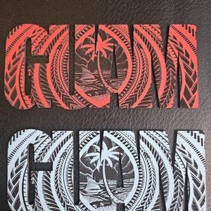 May include: Two wooden signs spelling out "GUAM" with intricate tribal designs. One sign is red with black detailing, the other is white with black detailing. Each letter features a tropical scene with palm trees and a sailboat.