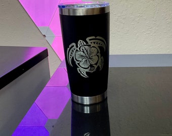Laser Engraved Polynesian Hibiscus Turtle design on a 20oz stainless steel tumbler