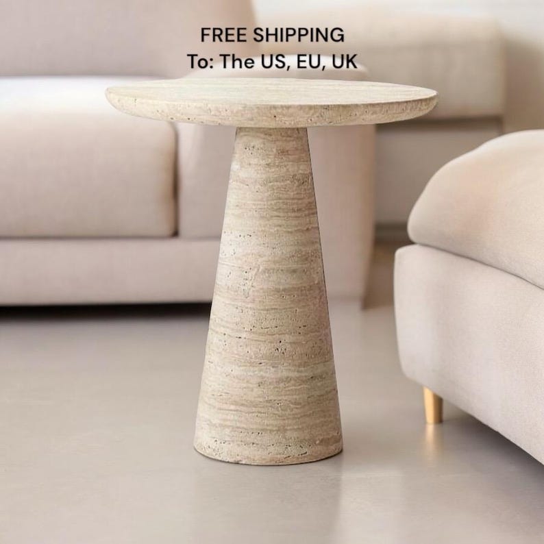 May include: A beige, round side table with a conical base. The table has a textured surface and a minimalist design, suitable for a living room or bedroom. The table's height is approximately 20 inches.