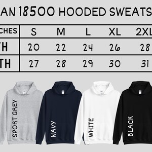 May include: Size chart for Gildan 18500 hooded sweatshirts in sizes S-3XL. The chart shows width and length measurements in inches. Four sweatshirts are shown in different colours: sport grey, navy, white, and black.