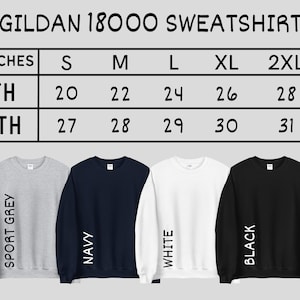 May include: Size chart for Gildan 18000 sweatshirts in inches. The chart shows width and length measurements for sizes S through 3XL. The chart is displayed above five sweatshirts in different colours: sport grey, navy, white, and black.