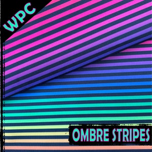 May include: Two pieces of fabric with black stripes and ombre colour gradients. The top piece is pink, purple, and blue. The bottom piece is green, yellow, and orange. The fabric is labelled "WPC Ombre Stripes".