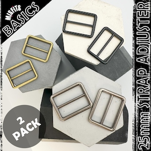 May include: Two pack of 25mm strap adjusters in black, silver, and gold. The adjusters are shown on a grey and black background. The text "2 PACK" and "25mm STRAP ADJUSTER" are visible in the image.