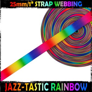 May include: 25mm/1 inch wide rainbow ombre strap webbing. The webbing is a gradient of colours from red to purple. The text "JAZZ-TASTIC RAINBOW" is printed on the bottom of the image.