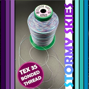 May include: A spool of multi-coloured thread labelled "Tex 35 Bonded Thread" and "Stormy Skies" with a green base. The thread is a mix of blue, purple, white, and black.