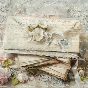 May include: A stack of vintage envelopes with handwritten script, adorned with white flowers and a ribbon. The envelopes have a postage stamp and are layered on a bed of lace and roses, creating a romantic, antique aesthetic.