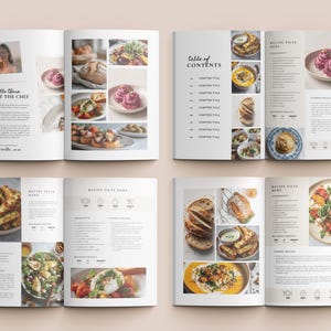 May include: A cookbook with a light beige cover, open to display various food photography. The pages feature images of dishes, including pasta, bread, and salads. Text includes "Table of Contents" and "Recipe Tilts Here."