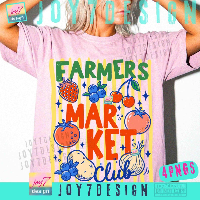 May include: Pink t-shirt with a colorful graphic design. The design features the words "FARMERS MARKET CLUB" with illustrations of fruits and vegetables, including a strawberry, blueberries, cherries, tomato, potato, and onion. The shirt has a crew neck.