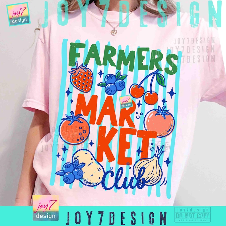 May include: A light pink t-shirt with a colorful graphic design. The design features the words "FARMERS MARKET CLUB" with illustrations of fruits and vegetables, including a strawberry, blueberries, cherries, and tomatoes.