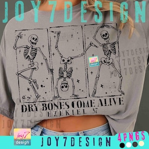 May include: Gray t-shirt with a black graphic of three dancing skeletons in rectangular frames. The text "DRY BONES COME ALIVE EZEKIEL 37" is printed below the skeletons. The shirt has a relaxed fit.