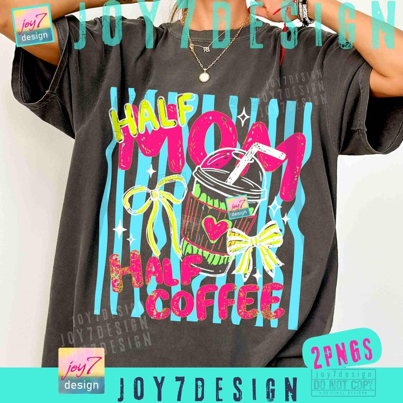 May include: Dark gray t-shirt with the text "HALF MOM HALF COFFEE" in pink and yellow. The design includes a coffee cup with a heart and bows, set against blue vertical stripes. The shirt has a vintage look.