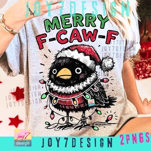 May include: A light gray t-shirt with a cartoon bird wearing a Santa hat and Christmas lights. The text "MERRY F-CAW-F" is above the bird. The design includes the text "JOY7DESIGN 2PNGS".
