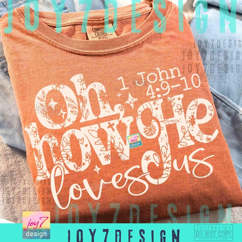 May include: A burnt orange Comfort Colors t-shirt with the text "Oh, how He loves us" in white script and block letters. The design includes floral and star accents, and the Bible verse 1 John 4:9-10.
