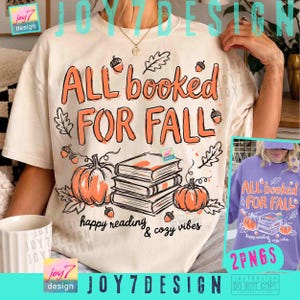 May include: A cream-colored t-shirt featuring the orange text ALL BOOKED FOR FALL, a stack of three books, two orange pumpkins, and scattered oak leaves and acorns. Below the books, the text reads happy reading & cozy vibes.