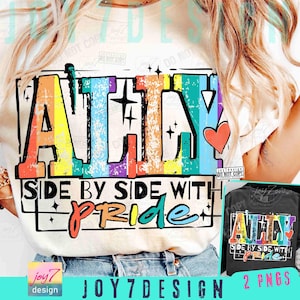 May include: Cream-colored t-shirt with a colorful graphic that reads "ALL IN" in rainbow hues, with the text "SIDE BY SIDE WITH PRIDE" below. A small red heart is on the right side of the graphic. A smaller image of the design on a black shirt is in the lower right corner.