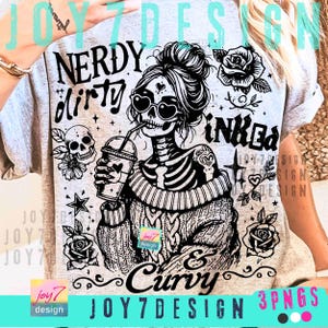 May include: A light gray t-shirt with a black and white graphic of a skeleton woman wearing heart-shaped sunglasses and drinking from a cup. The shirt has the words "NERDY dirty INKED & Curvy" printed on it, along with rose and star illustrations.