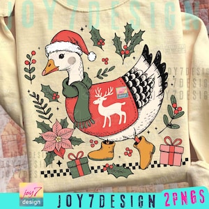 May include: Cream-colored sweatshirt featuring a festive goose wearing a Santa hat, scarf, and a red vest with a reindeer design. The design includes holly, gifts, and boots, perfect for the holiday season. The text "JOY7DESIGN 2PNGS" is at the bottom.