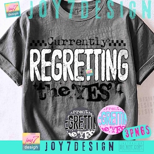 May include: A charcoal gray short-sleeve t-shirt featuring the distressed white and black text Currently REGRETTING the YES with small star accents. The design includes a checkered pattern above the text and two circular color variations below.
