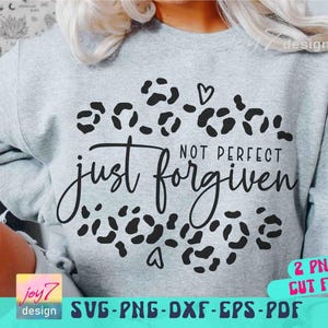 May include: A light gray sweatshirt with the words "just forgiven, not perfect" in black script and a leopard print design. The image also includes the text "2 PNGS CUT FILE" and "SVG-PNG-DXF-EPS-PDF".