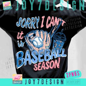 May include: Black sweatshirt with a baseball-themed graphic. The design features a baseball, glove, bat, and a drink, along with the text "Sorry I can't, it is Baseball Season" in blue and pink lettering.