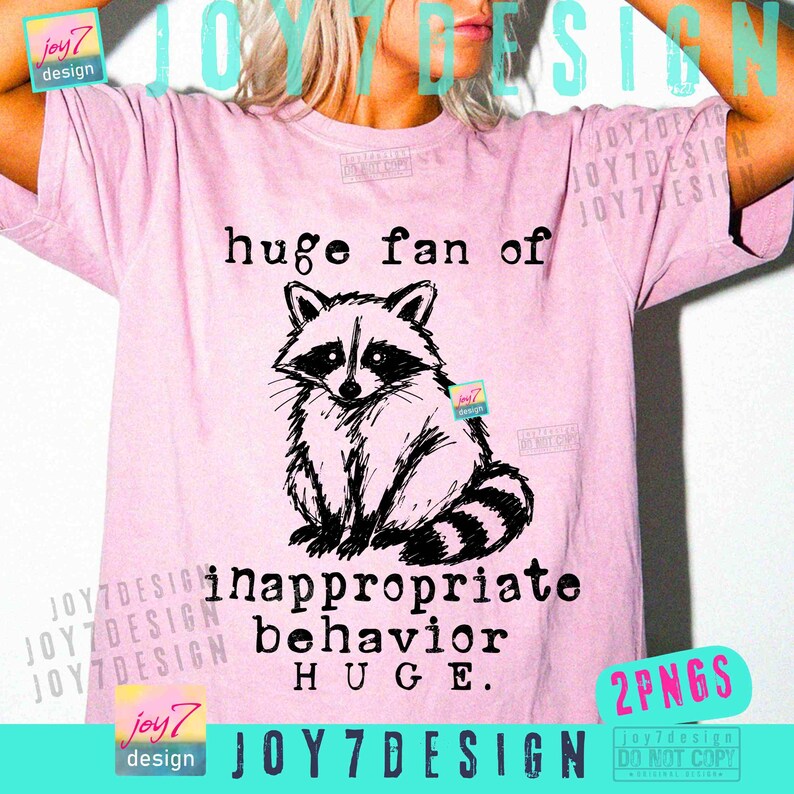 May include: A light pink t-shirt with the text "huge fan of inappropriate behavior HUGE" and a black and white raccoon illustration. The shirt is a casual wear item.