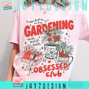 May include: Pink t-shirt with a gardening-themed graphic. The design features the words "Gardening Obsessed Club" and "Members Only" in red and green, along with illustrations of tomatoes, carrots, and gardening tools.