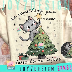 May include: Cream-colored sweatshirt with a cartoon cat decorating a Christmas tree. The cat is gray with a star on top of the tree. The text reads "do something you never dared to do before."