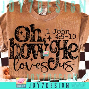 May include: A brown long-sleeved shirt with the text "Oh how He loves us" in black script and block letters. The text includes the Bible verse 1 John 4:9-10. The shirt has a Comfort Colors tag.