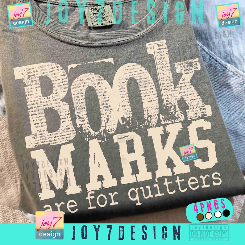 May include: A gray t-shirt with the words "BOOK MARKS are for quitters" in a distressed, newspaper-style font. The shirt has a crew neck and short sleeves. The design is in white, contrasting against the gray fabric.