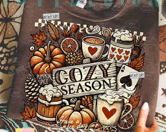 May include: Brown sweatshirt with a fall-themed graphic. The design includes pumpkins, coffee mugs with hearts, leaves, and the text "COZY SEASON" and "Have a nice day".