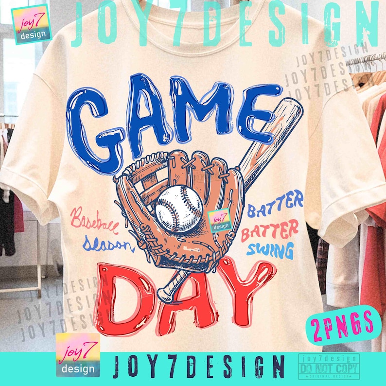 May include: Cream-colored t-shirt with a baseball-themed graphic. The design features the words "GAME DAY" in blue and red, a baseball glove, a baseball, and a bat. The words "Baseball Season", "Batter, Batter, Swing" are also included.