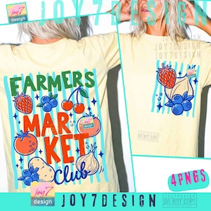 May include: Cream-colored t-shirt with a colorful graphic design. The design features the words "FARMERS MARKET CLUB" with illustrations of fruits and vegetables. The shirt also has blue vertical stripes.