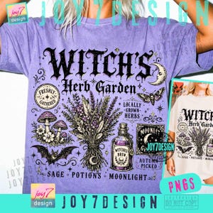 May include: A light purple short-sleeve t-shirt featuring a black graphic print with the text "Witch's Herb Garden". The design includes illustrations of a lavender bouquet, mushrooms, a bat, a moth, a crescent moon, and a potion bottle.