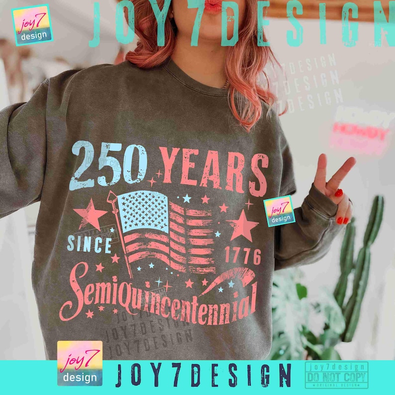 May include: Dark olive green sweatshirt with a graphic celebrating the 250th anniversary of the United States. The design includes the text "250 YEARS SINCE 1776 Semiquincentennial" with an American flag and stars.