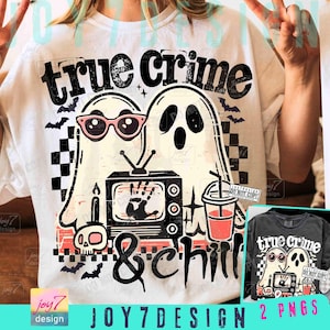 May include: White t-shirt with a graphic featuring two ghost characters, one wearing pink sunglasses. The design includes a retro TV, bats, a skull, and the words "true crime & chill". The design is in black, white, and pink.