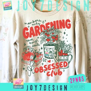 May include: Cream-colored sweatshirt with a gardening-themed graphic. The design features the word "GARDENING" in red, along with illustrations of tomatoes, carrots, gardening tools, and the text "Obsessed Club". The text "members only, never enough seeds" is also included.