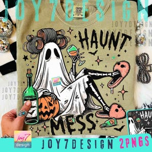 May include: Olive green t-shirt with a Halloween-themed graphic. The design features a ghost with curlers, holding a wine glass and wearing fuzzy slippers. The text "HAUNT MESS" is also included.