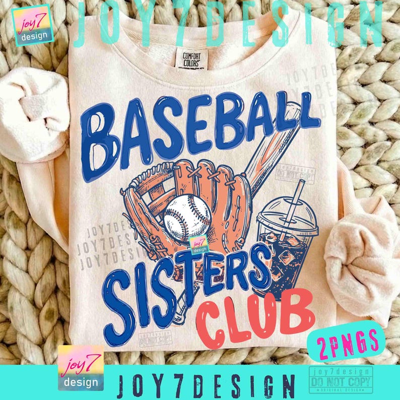May include: A light peach-colored sweatshirt with a baseball-themed graphic. The design features the word "BASEBALL" in blue, a baseball glove, a baseball, and the words "SISTERS CLUB" in blue and red. A drink with ice and a straw is also shown.