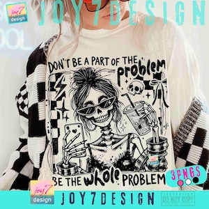 May include: White graphic tee featuring a skeleton with sunglasses taking a selfie and holding a drink. The text reads "DON'T BE A PART OF THE PROBLEM, BE THE WHOLE PROBLEM." The design is black and white.