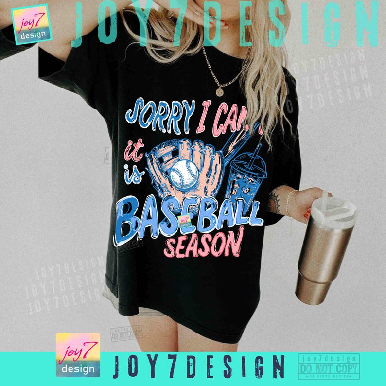 May include: Black t-shirt with the text "SORRY I CAN'T IT IS BASEBALL SEASON" in pink and blue. The graphic includes a baseball glove, baseball, and a drink. The shirt is a casual, oversized fit.
