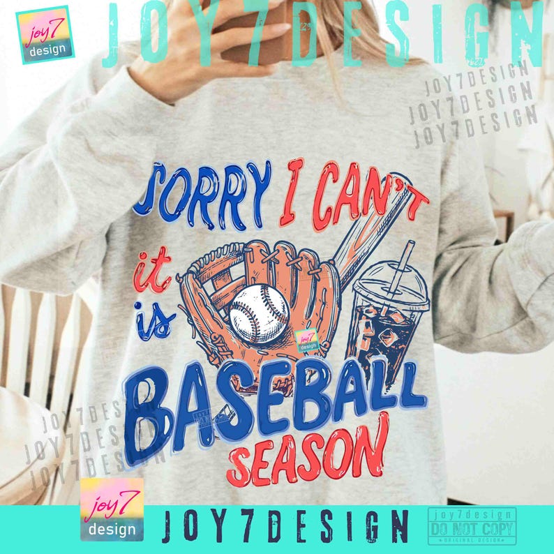 May include: A light gray sweatshirt with a baseball-themed graphic. The graphic includes a baseball, mitt, bat, and a drink with a straw. Text on the sweatshirt reads "SORRY I CAN'T it is BASEBALL SEASON."