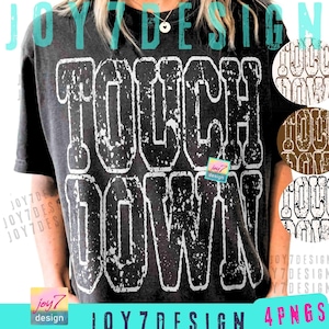 May include: Dark gray t-shirt with the words "TOUCH DOWN" in distressed white lettering. The shirt has a vintage, worn look. The image also includes a small "joy7 design" logo and additional design variations.
