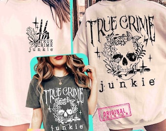 May include: The image showcases three different t-shirts and sweatshirts with the text "TRUE CRIME junkie". The designs include a skeleton hand, a skull with floral elements, and the text "TRUE CRIME" in a gothic font. The color palette is primarily black and white.