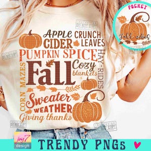 May include: Cream-colored t-shirt with fall-themed graphics. The design includes orange pumpkins, fall leaves, and text such as "Fall," "Pumpkin Spice," and "Sweater Weather." A circular graphic reads "Fall Vibes."
