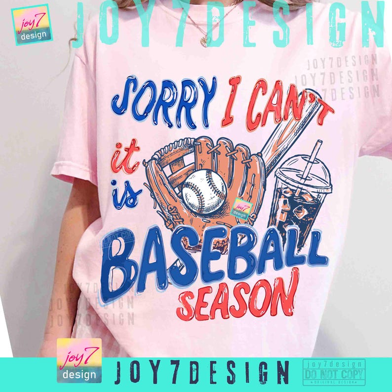 May include: A light pink t-shirt with a baseball-themed graphic. The design includes a baseball glove, baseball, drink, and the text "SORRY I CAN'T IT IS BASEBALL SEASON" in blue and red. The shirt has short sleeves.