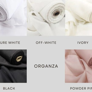 May include: A close-up of six fabric swatches rolled up. The swatches are in the colors: pure white, off-white, ivory, black, and powder pink. The fabric is organza.