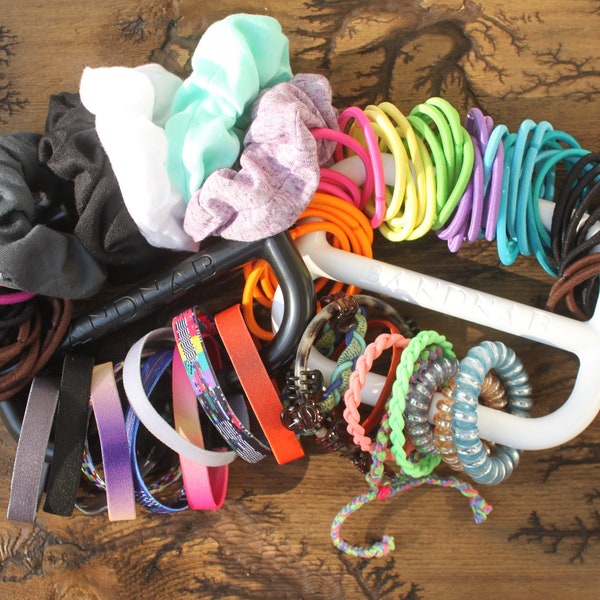 The BANDNAB hair tie, scrunchie, and banded accessories organizer makes a great unique gift for anyone with long hair.