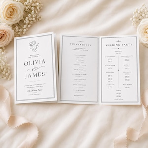 May include: A white folded wedding programme featuring black serif typography. The front cover displays the names Olivia and James, while the interior panels list the ceremony order and wedding party members with placeholders for names and titles.