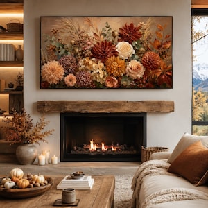 May include: A large floral painting featuring a variety of flowers in shades of red, orange, and cream. The artwork hangs above a fireplace with a wooden mantel. The room is decorated in warm, neutral tones, creating a cozy and inviting atmosphere.