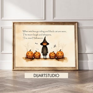 May include: A framed Halloween-themed watercolor print. The artwork features a smiling witch figure with a pumpkin head, standing in front of five carved pumpkins. The text reads, "When witches go riding and black cat are seen, The moon laugh and whispers, 'Tis, near Halloween."